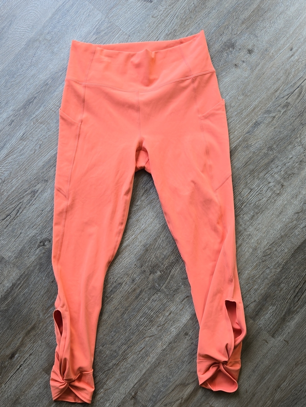 Fabletics Coral-Orange Leggings with Knot Hem